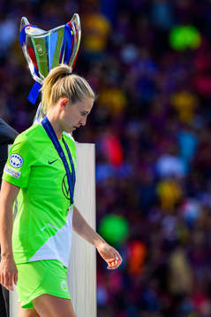 Rebecka Blomqvist of Wolfsburg looks dejected as she passes
