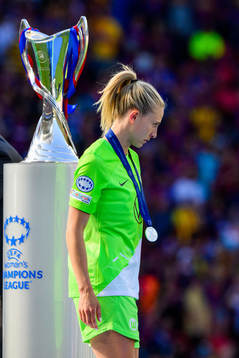 Rebecka Blomqvist of Wolfsburg looks dejected as she passes