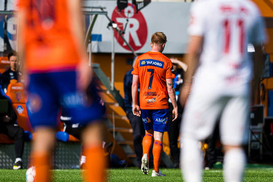 Kasper Lunding of Aalesund leaves the pitch with an injury