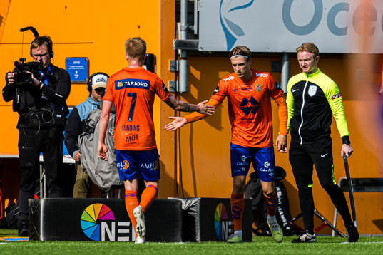 Kasper Lunding of Aalesund leaves the pitch with an injury