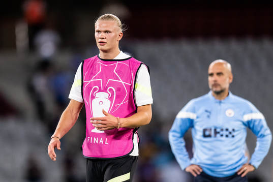 Erling Braut Haaland and Pep Guardiola, head coach of