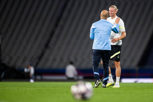 Pep Guardiola, head coach, and Erling Braut Haaland of
