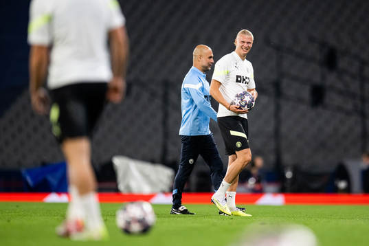 Pep Guardiola, head coach, and Erling Braut Haaland of