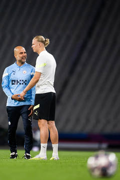 Pep Guardiola, head coach, and Erling Braut Haaland of