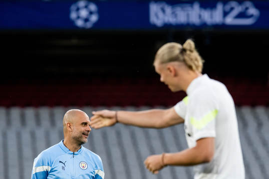 Pep Guardiola, head coach, and Erling Braut Haaland of