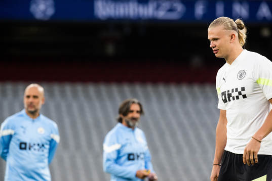 Pep Guardiola, head coach, and Erling Braut Haaland of