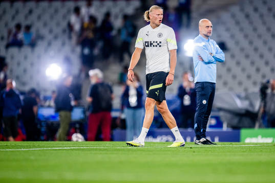 Erling Braut Haaland and Pep Guardiola, head coach of