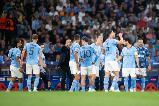 Head coach Pep Guardiola and Erling Braut Haaland of