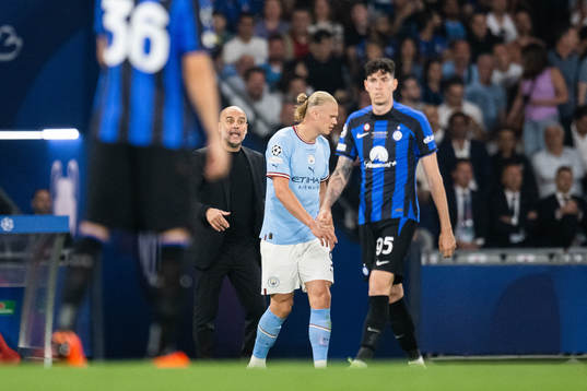 Head coach Pep Guardiola and Erling Braut Haaland of