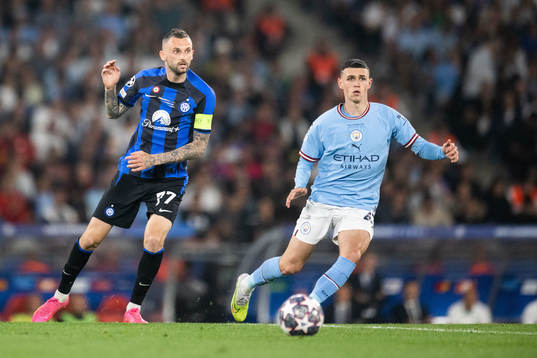Milan Skriniar of Inter and Phil Foden of Manchester City