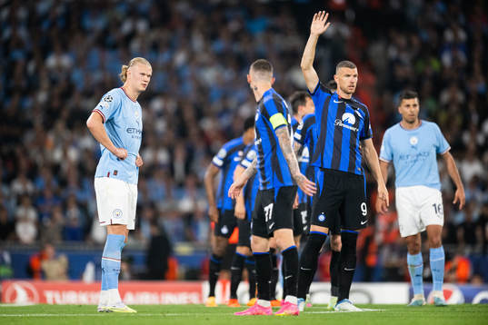 Erling Braut Haaland of Manchester City and Edin Dzeko of