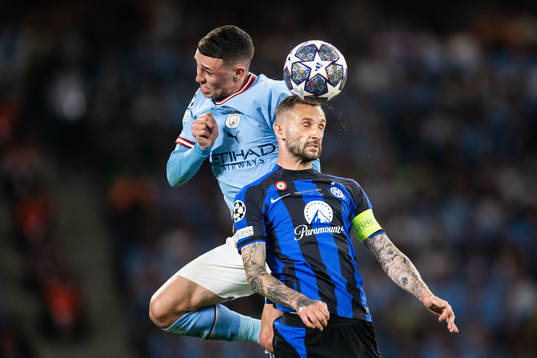 Phil Foden of Manchester City and Marcelo Brozovic of Inter