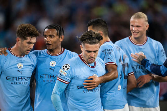 Rodri of Manchester City celebrates with John Stones,