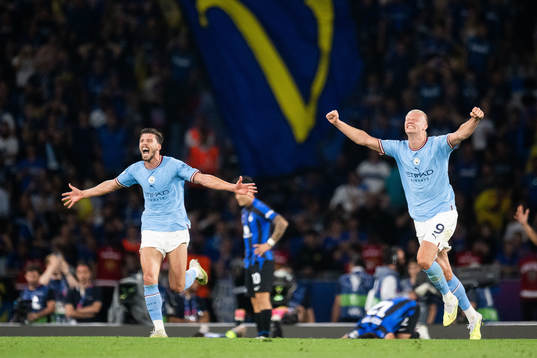 Ruben Dias and Erling Braut Haaland of Manchester City
