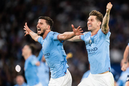 Ruben Dias and John Stones of Manchester City celebrate