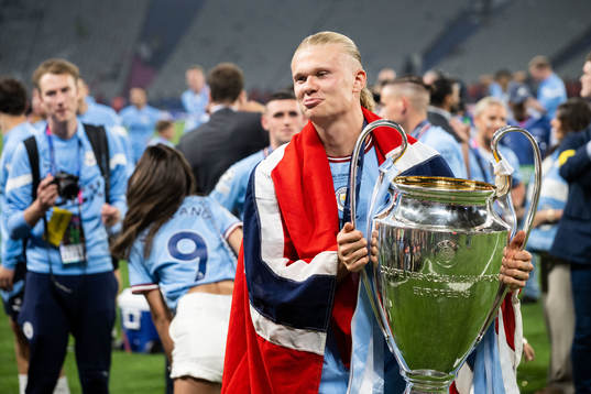 Erling Braut Haaland of Manchester City and the trophy
