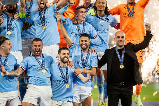 Head coach Pep Guardiola and players of Manchester City