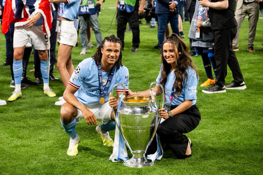 Nathan Ake of Manchester City celebrates with the trophy
