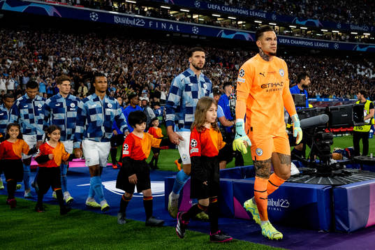Goalkeeper Ederson of Manchester City enters the pitch