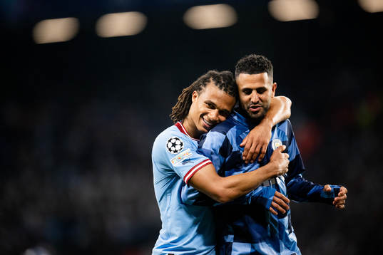 Nathan Ake and Riyad Mahrez of Manchester City