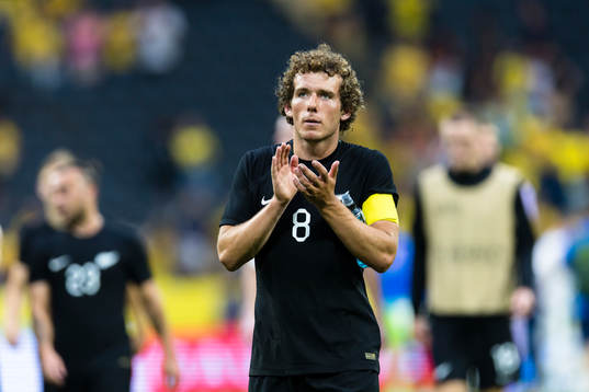 Joe Bell of New Zealand thanks the supporters