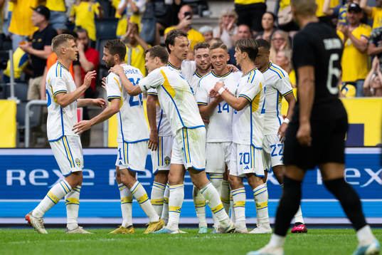 Jesper Karlsson of Sweden celebrates with his team mates