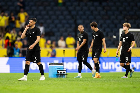 Players of of New Zealand look dejected