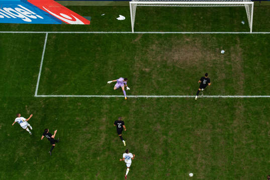 Jesper Karlsson of Sweden scores 3-1 behind goalkeeper Oli