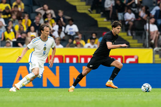 Hjalmar Ekdal of Sweden and Matt Garbett  of New Zealand