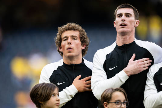 Joe Bell and goalkeeper Oli Sail of New Zealand of New