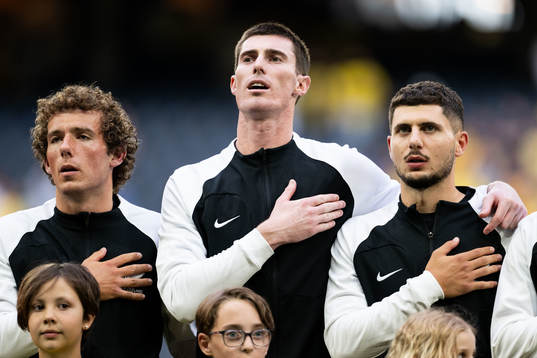 Joe Bell, goalkeeper Oli Sail and Liberato Cacace  of New