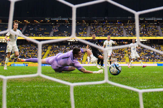 Goalkeeper Oli Sail of New Zealand lets in the 1-1 goal by