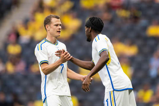 Viktor Claesson changes with Anthony Elanga of Sweden