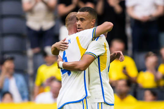 Daniel Sundgren and Robin Quaison of Sweden celebrate the