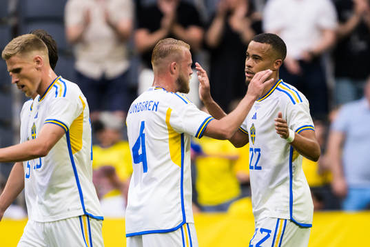 Daniel Sundgren and Robin Quaison of Sweden celebrate the