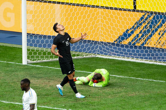 Max Mata of New Zealand looks dejected and goalkeeper