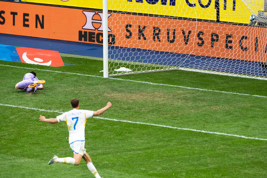 Goalkeeper Oli Sail looks dejected and Viktor Claesson of