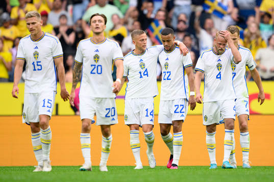 Jesper Karlsson and Robin Quaison of Sweden celebrate