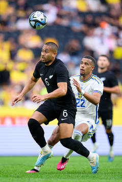 Bill Tuiloma of New Zealand and Robin Quaison of Sweden