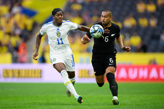 Anthony Elanga of Sweden and Bill Tuiloma of New Zealand