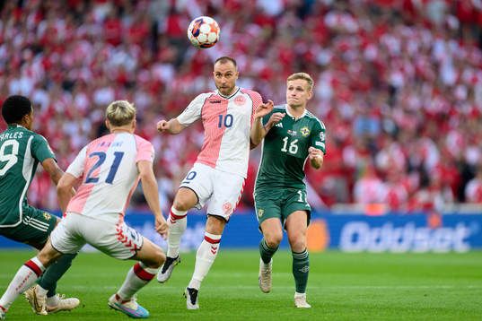 Christian Eriksen of Denmark and Alistair McCann of