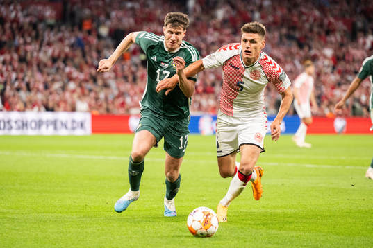 Paddy McNair of Northern Ireland and Joakim Mæhle of