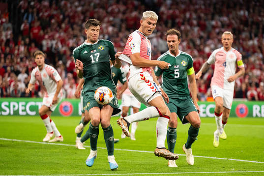 Jonas Wind of Denmark against Paddy McNair and Jonny Evans