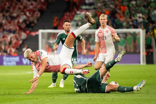 Jonas Wind of Denmark and Paddy McNair of Northern Ireland