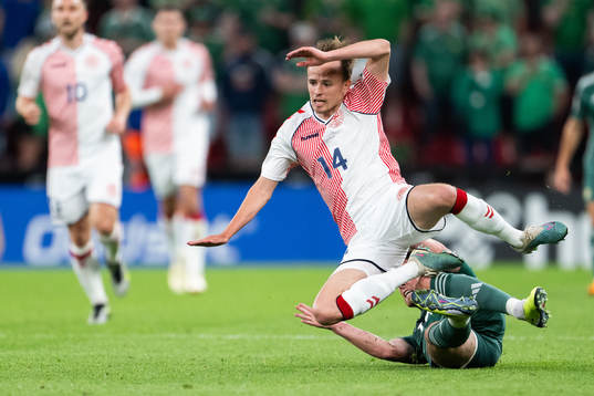 Jordan Thompson of Northern Ireland and Mikkel Damsgaard of