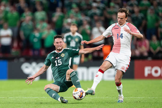 Jordan Thompson of Northern Ireland and Mikkel Damsgaard of