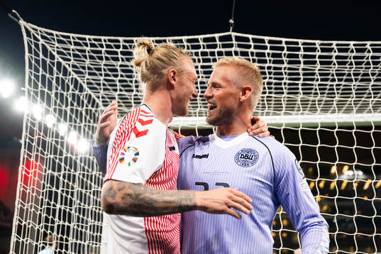 Simon Kjær and Goalkeeper Kasper Schmeichel of Denmark