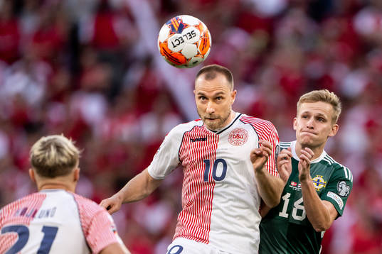 Christian Eriksen of Denmark and Alistair McCann of