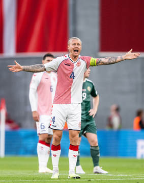 Simon Kjær of Denmark reacts