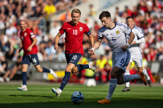 Martin Ødegaard of Norway and Kieran Tierney of Scotland